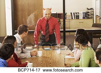 Picture - businessman with 
devil horns at 
meeting. fotosearch 
- search stock 
photos, pictures, 
images, and photo 
clipart