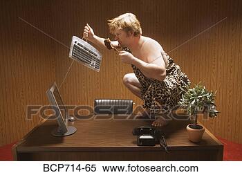 Stock Image - businessman dressed 
as caveman crouching 
on desk. fotosearch 
- search stock 
photos, pictures, 
images, and photo 
clipart