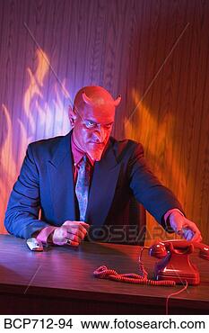 Stock Photo - businessman dressed 
as devil at desk. 
fotosearch - search 
stock photos, 
pictures, images, 
and photo clipart