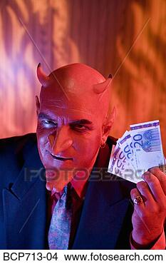 Stock Photo - businessman dressed 
as devil holding 
money. fotosearch 
- search stock 
photos, pictures, 
images, and photo 
clipart