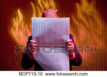 Stock Photography - businessman dressed 
as devil reading 
newspaper. fotosearch 
- search stock 
photos, pictures, 
images, and photo 
clipart