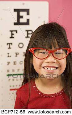 Stock Photo - girl wearing eyeglasses 
in front of eye 
chart. fotosearch 
- search stock 
photos, pictures, 
images, and photo 
clipart