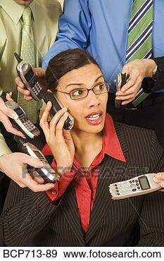 Stock Photograph - overwhelmed businesswoman 
surrounded by 
co-workers. fotosearch 
- search stock 
photos, pictures, 
images, and photo 
clipart