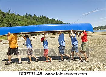 Stock Photo - male camp counselor 
and children carrying 
canoe. fotosearch 
- search stock 
photos, pictures, 
images, and photo 
clipart