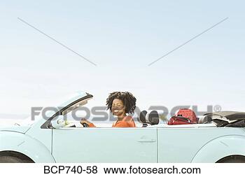 Stock Photo - african woman 
driving convertible 
car. fotosearch 
- search stock 
photos, pictures, 
images, and photo 
clipart