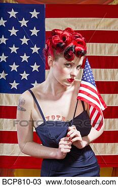 Stock Photo - woman in front 
of american flag. 
fotosearch - search 
stock photos, 
pictures, images, 
and photo clipart