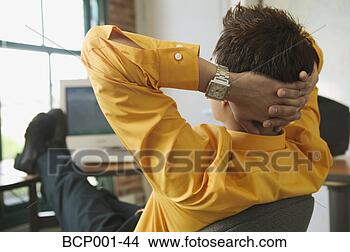 Stock Photo - a man leaning 
back at his desk 
and thinking. 
fotosearch - search 
stock photos, 
pictures, images, 
and photo clipart