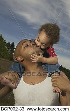 Stock Photo - a father kissing 
his son. fotosearch 
- search stock 
photos, pictures, 
images, and photo 
clipart