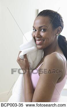 Stock Image - woman drying her 
face with a towel. 
fotosearch - search 
stock photos, 
pictures, images, 
and photo clipart