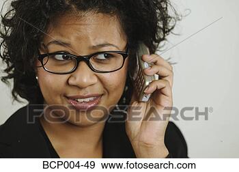 Stock Photograph - close-up of a 
woman on a mobile 
phone. fotosearch 
- search stock 
photos, pictures, 
images, and photo 
clipart