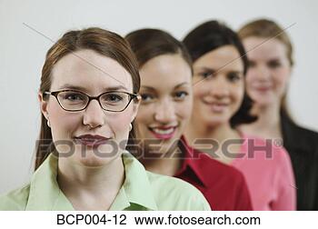 Stock Photo - four young businesswomen. 
fotosearch - search 
stock photos, 
pictures, images, 
and photo clipart