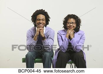 Stock Image - young couple seated 
side by side. 
fotosearch - search 
stock photos, 
pictures, images, 
and photo clipart