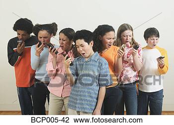 Stock Photo - seven teenagers 
talking on mobile 
phones. fotosearch 
- search stock 
photos, pictures, 
images, and photo 
clipart
