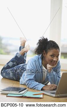 Stock Photography - teenage girl working 
on a laptop computer. 
fotosearch - search 
stock photos, 
pictures, images, 
and photo clipart