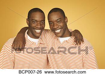 Stock Photo - studio portrait 
of twin teenage 
boys. fotosearch 
- search stock 
photos, pictures, 
images, and photo 
clipart