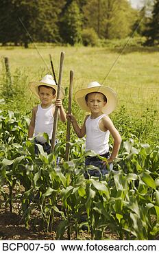 Stock Photography - twin boys working 
on the family 
farm. fotosearch 
- search stock 
photos, pictures, 
images, and photo 
clipart