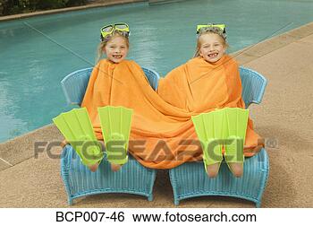 Stock Photo - young, twin girls 
share a towel 
poolside. fotosearch 
- search stock 
photos, pictures, 
images, and photo 
clipart