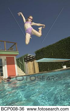 Stock Photo - girl leaping into 
a swimming pool. 
fotosearch - search 
stock photos, 
pictures, images, 
and photo clipart