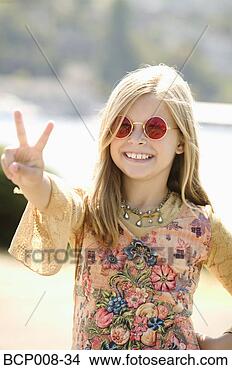 Stock Photo - young girl in 
sunglasses making 
a peace sign. 
fotosearch - search 
stock photos, 
pictures, images, 
and photo clipart