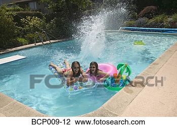 Stock Photo - teenagers playing 
in a swimming 
pool. fotosearch 
- search stock 
photos, pictures, 
images, and photo 
clipart