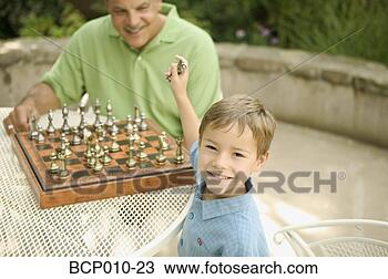Stock Photo - grandfather at 
a chess table 
smiling at his 
young grandson. 
fotosearch - search 
stock photos, 
pictures, images, 
and photo clipart