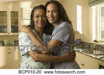 Stock Photography - mother and her 
adult daughter 
embrace. fotosearch 
- search stock 
photos, pictures, 
images, and photo 
clipart