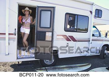 Stock Photography - young woman in 
the doorway of 
a motor home. 
fotosearch - search 
stock photos, 
pictures, images, 
and photo clipart