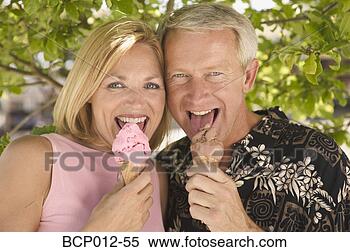 Stock Image - couple eating 
ice cream cones. 
fotosearch - search 
stock photos, 
pictures, images, 
and photo clipart