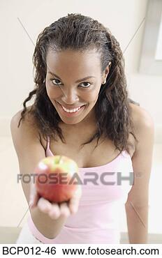 Stock Photo - family preparing 
food and eating 
together in the 
kitchen. fotosearch 
- search stock 
photos, pictures, 
images, and photo 
clipart