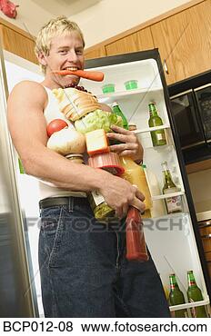 Stock Photo - man with his arms 
full of food. 
fotosearch - search 
stock photos, 
pictures, images, 
and photo clipart