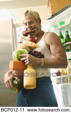 Stock Photography - man with his arms 
full of food. 
fotosearch - search 
stock photos, 
pictures, images, 
and photo clipart