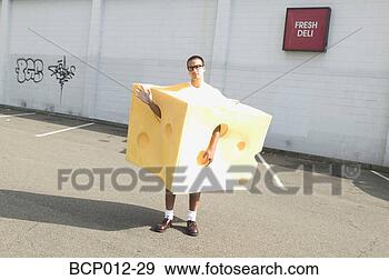 Stock Photograph - man on the street 
wearing a cheese 
costume. fotosearch 
- search stock 
photos, pictures, 
images, and photo 
clipart