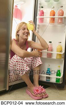 Stock Photo - woman sitting 
in an open refrigerator. 
fotosearch - search 
stock photos, 
pictures, images, 
and photo clipart