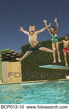 Stock Photography - young boy leaping 
off a diving board. 
fotosearch - search 
stock photos, 
pictures, images, 
and photo clipart