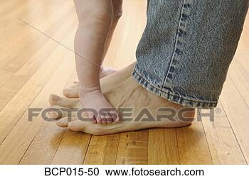 Stock Photography - father's and baby's 
bare feet. fotosearch 
- search stock 
photos, pictures, 
images, and photo 
clipart