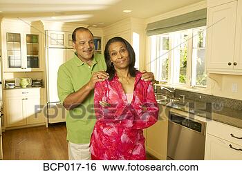 Stock Photo - a senior couple 
in their kitchen. 
fotosearch - search 
stock photos, 
pictures, images, 
and photo clipart