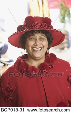 Stock Photography - portrait of a 
senior woman wearing 
a fancy red hat. 
fotosearch - search 
stock photos, 
pictures, images, 
and photo clipart