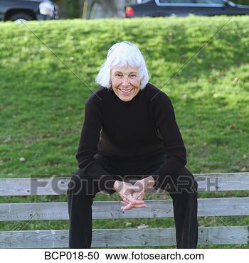 Stock Photography - portrait of a 
senior woman sitting 
on a park bench. 
fotosearch - search 
stock photos, 
pictures, images, 
and photo clipart