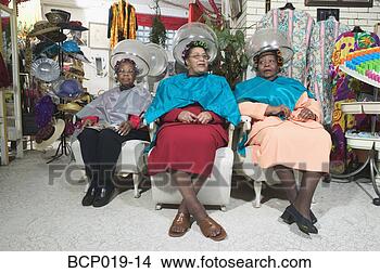 Stock Photo - three senior women 
sitting under 
hairdryers. fotosearch 
- search stock 
photos, pictures, 
images, and photo 
clipart