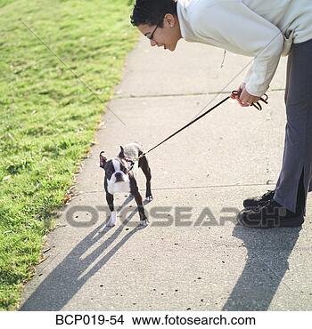 Stock Photo - young woman talking 
to her dog. fotosearch 
- search stock 
photos, pictures, 
images, and photo 
clipart