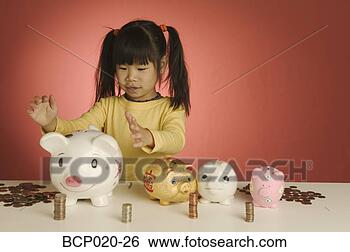 Stock Photo - little girl with 
stacks of coins 
and piggybanks. 
fotosearch - search 
stock photos, 
pictures, images, 
and photo clipart