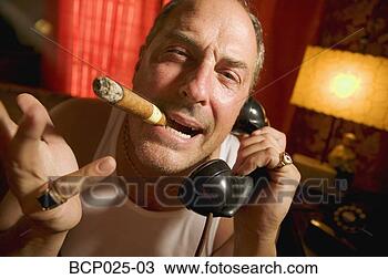 Stock Photo - man with a cigar 
in his mouth. 
fotosearch - search 
stock photos, 
pictures, images, 
and photo clipart