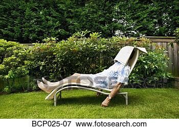 Picture - man napping in 
his backyard. 
fotosearch - search 
stock photos, 
pictures, images, 
and photo clipart