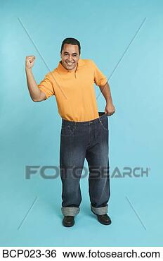 Stock Photo - man wearing pants 
that are too large. 
fotosearch - search 
stock photos, 
pictures, images, 
and photo clipart