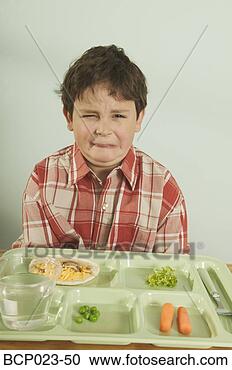 Stock Photography - a young boy unhappy 
with his plate 
of food. fotosearch 
- search stock 
photos, pictures, 
images, and photo 
clipart