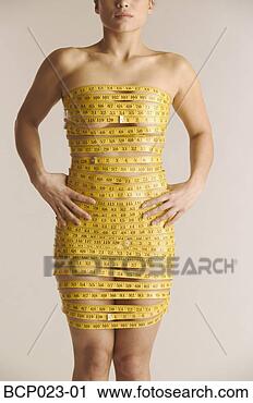 Stock Photography - young woman wrapped 
in measuring tape. 
fotosearch - search 
stock photos, 
pictures, images, 
and photo clipart