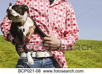Stock Photo - man holding a 
dog. fotosearch 
- search stock 
photos, pictures, 
images, and photo 
clipart