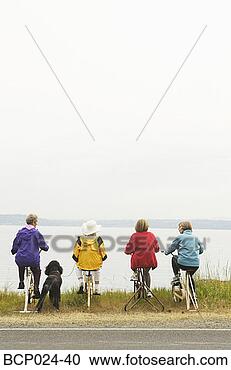 Stock Photography - four women on 
stationary bikes. 
fotosearch - search 
stock photos, 
pictures, images, 
and photo clipart