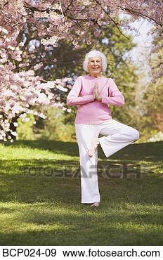 Stock Photograph - older woman in 
a yoga position. 
fotosearch - search 
stock photos, 
pictures, images, 
and photo clipart