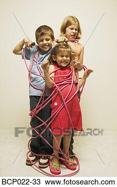 Stock Photo - three totally 
wired children. 
fotosearch - search 
stock photos, 
pictures, images, 
and photo clipart